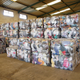 Multi-colored bales of used clothing